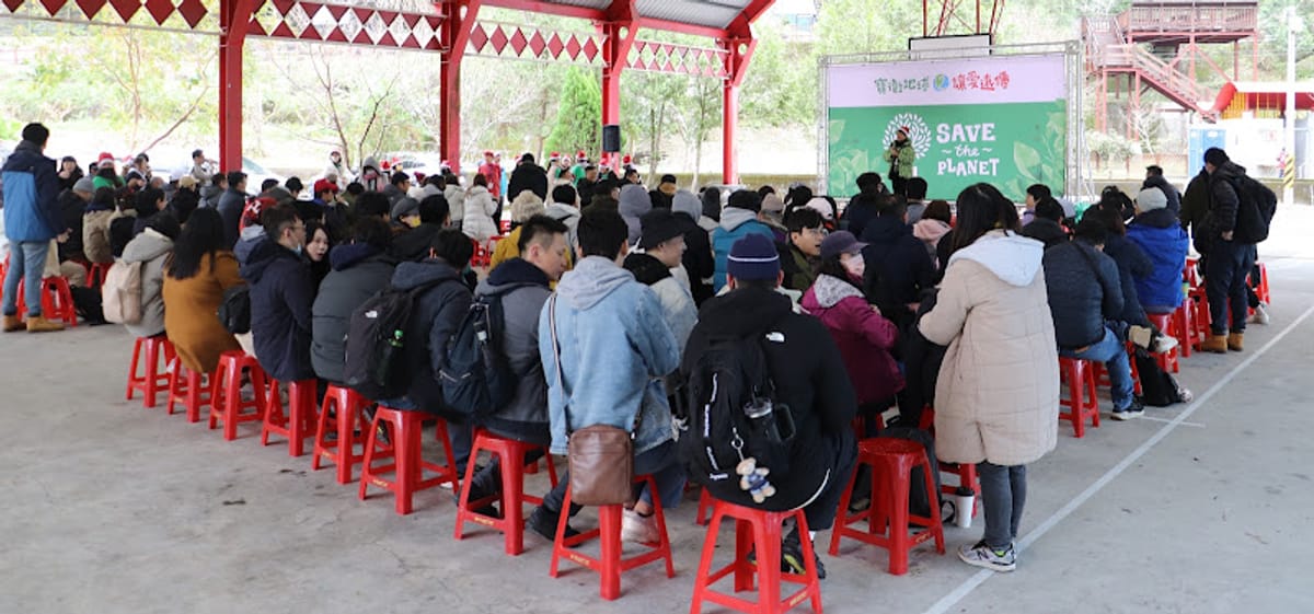 Participants sit in a circle at the community site for the closing dialogue
